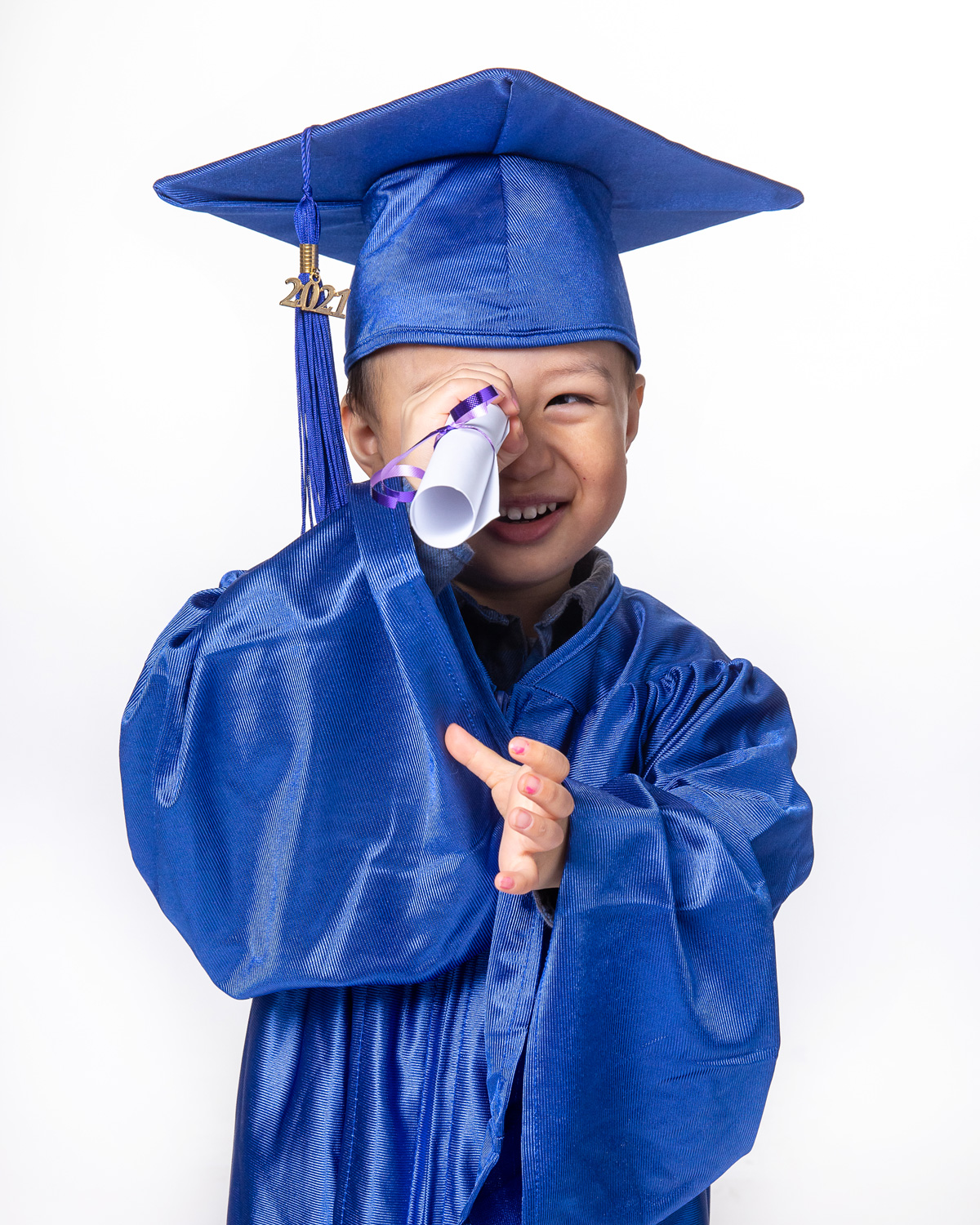 Little boy in cap and gown