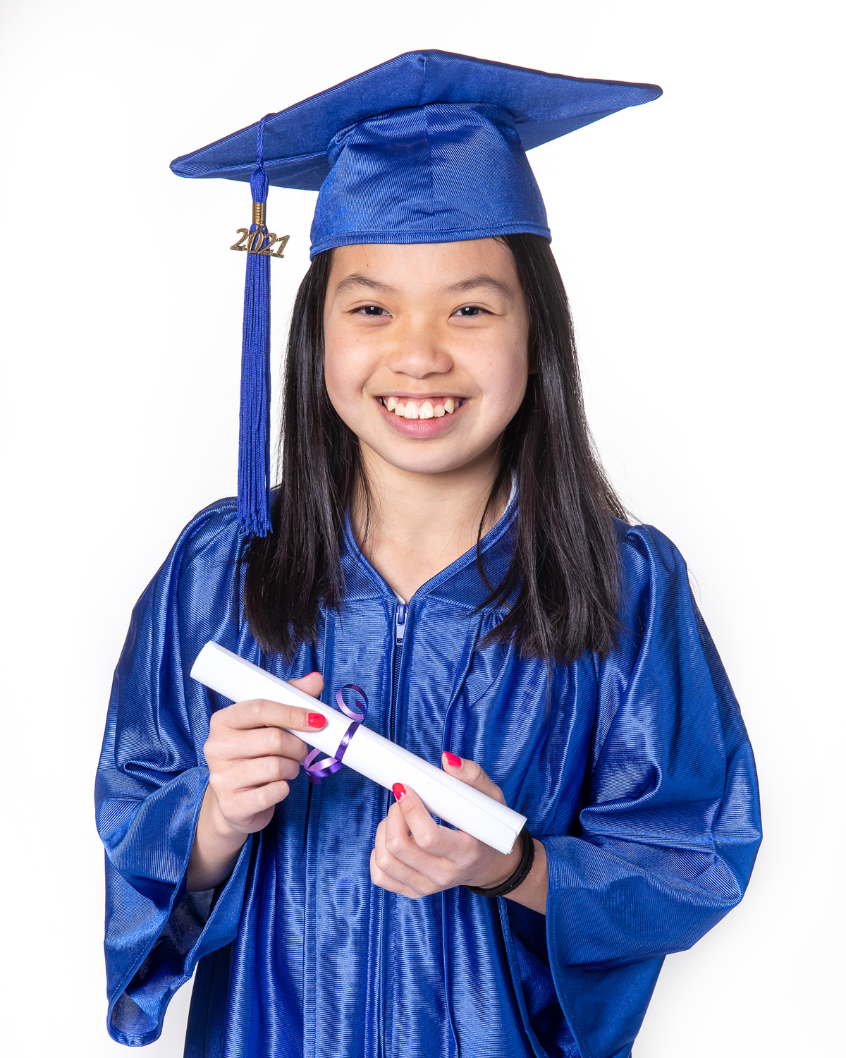 Grade 6 girl in cap and gown